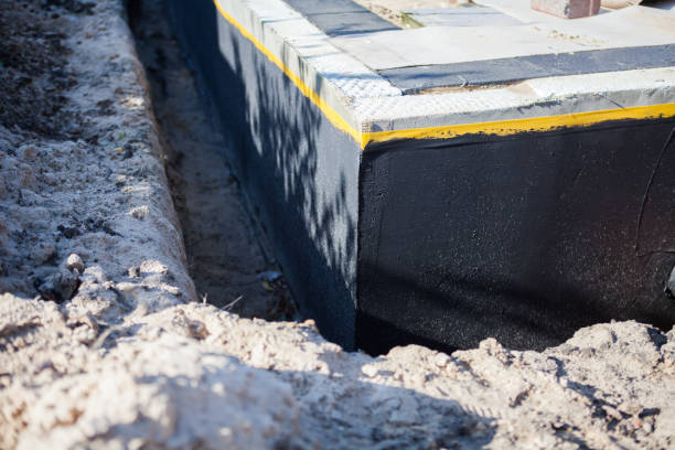 Professional Basement Waterproofing technician working in Briggsville, WI